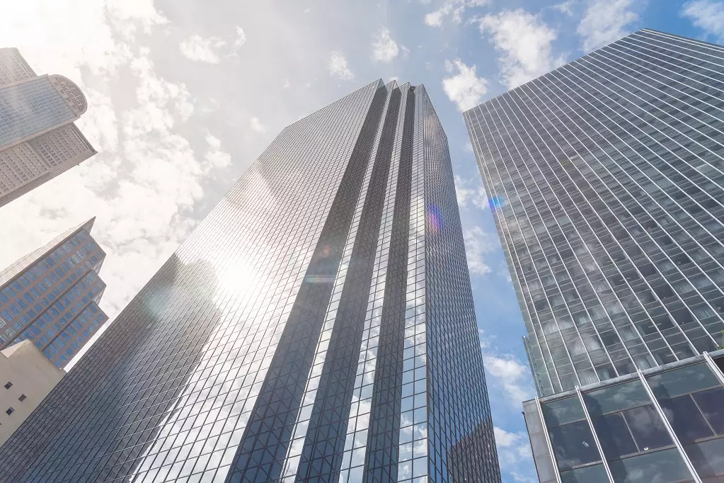 Low perspective angle view of Dallas skylines with cloud blue sky